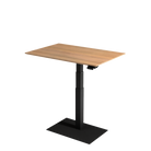 Stylish small electric standing desk with oak tabletop and black metal pedestal.