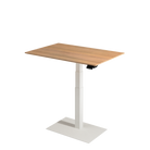 Stylish small electric standing desk with oak tabletop and black metal pedestal.