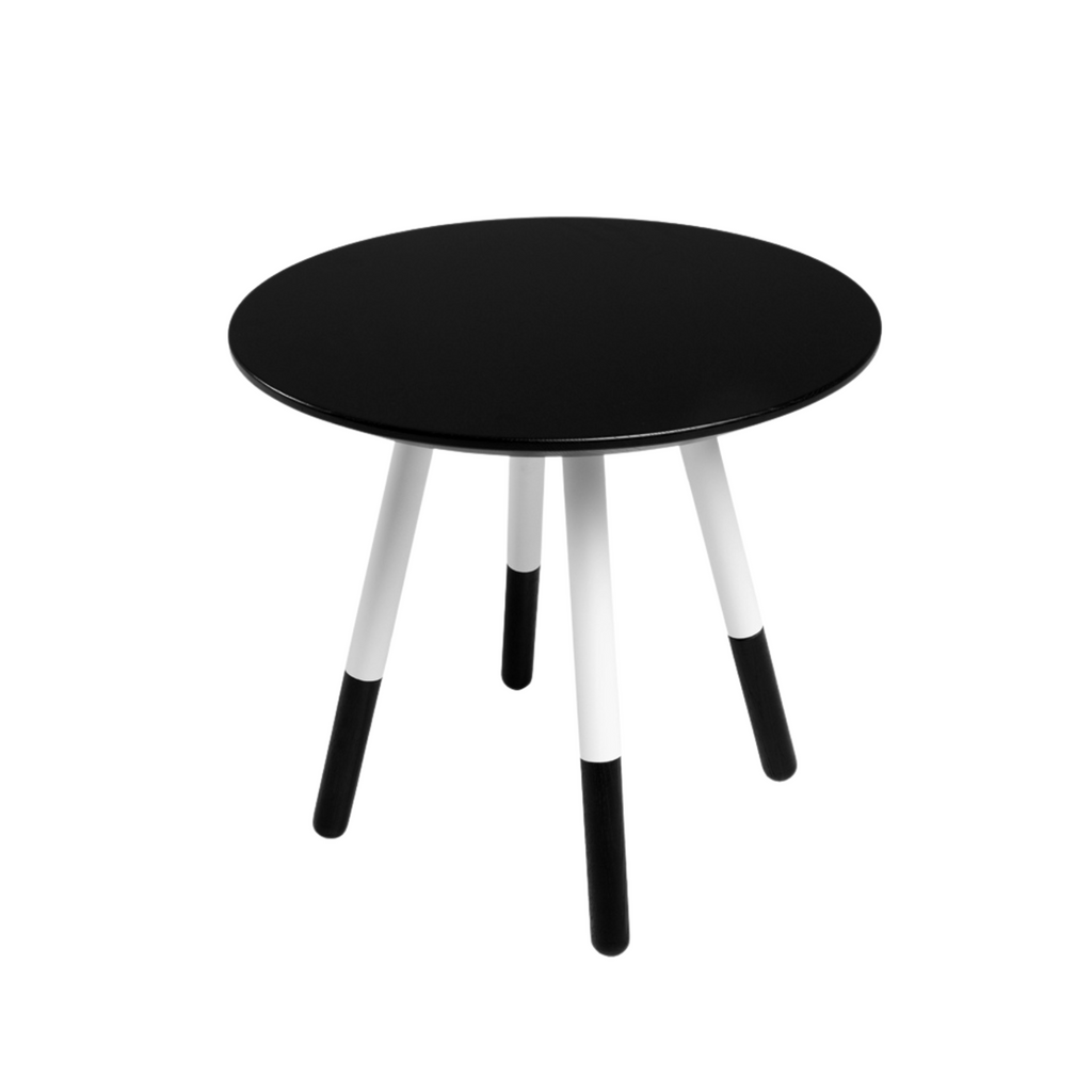 Daywalker coffee table with a black tabletop and white-and-black legs, 55 cm diameter.