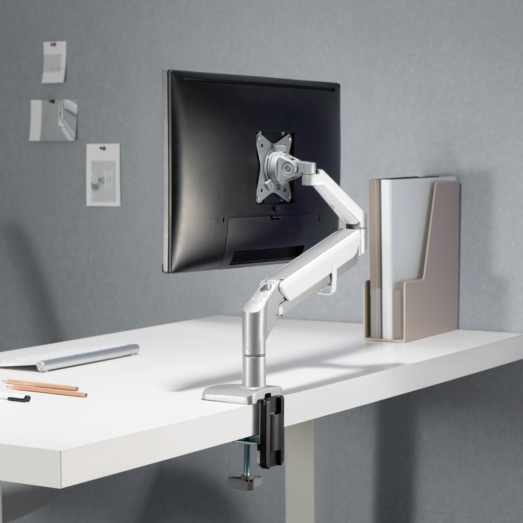 Gas-Spring LCD Monitor Arm attached to a desk, showcasing adjustable features for ergonomic working